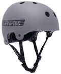 Old School Low Pro Certified Helmet with Deep Fit and SlimTech Core in matte grey, side view showing strap and ventilation holes.