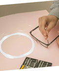 Hand using Half Frame Glasses Thread Replacement Kit For Eyeglasses, Eyewear Repair String and Nylon Temple Tips Lanyard on pink surface