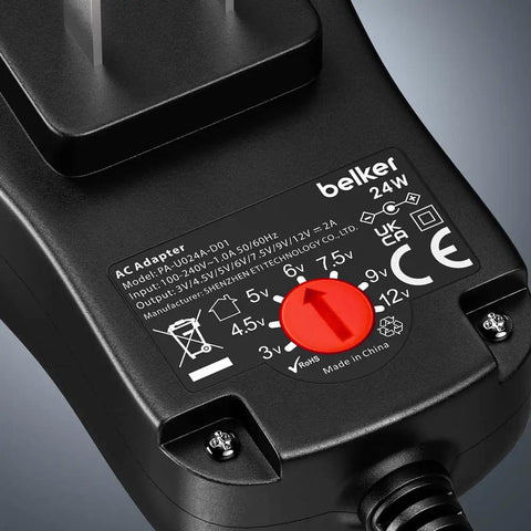 Close-up of Universal 24W Multi Voltage AC DC Power Adapter with adjustable voltage dial and input specifications