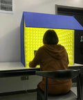 Solid Portable Desktop Soundproof Booth Cube Packed With Dense Acoustic Foam Panels For Dead Silent Mic Takes Home Studio Vocal Tracking And Room Noise Culling, viewed from behind.