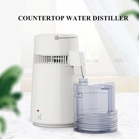 Built Tough Water Distiller Machine Packs 750 Watt Heating Coil with clear four liter catch bucket on countertop.