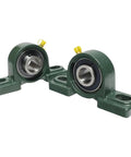 Top Tier Self Aligning 2 Pack UCP20412 Heavy Duty Pillow Block Ball Bearing With Three Quarter Inch Bore Cast Iron Base Built Workhorse For Grinding Heavy Load Works Ensuring Dust Free Sealed Bearings That Resist Rust And Run Silently Always., two green cast iron pillow block bearings with 3/4 inch bore