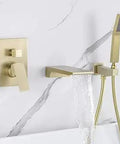 Wall Mount Roman Tub Filler Faucet With Single Handle And Hand Sprayer, Waterfall Spout, Brushed Gold Finish on marble wall
