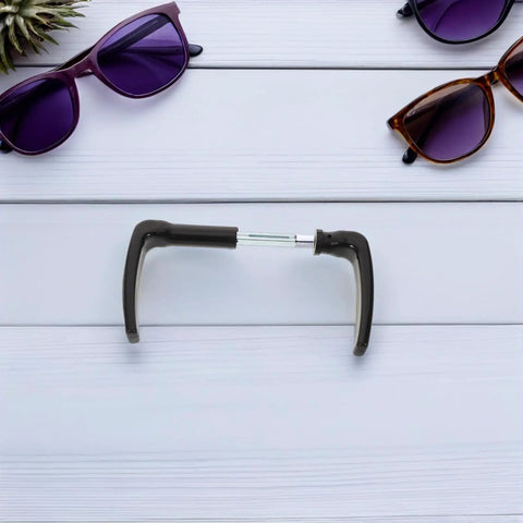 Eyeglasses with black frames and purple lenses on white wood background
