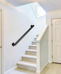 Badass 6ft Black Wrought Iron Stair Railing Wall Mount Kit Non Slip Handrail And Iron Grab Bar Perfect For Indoor Stairs Boosts Safety While Looking Sweet On Your Home Decor Stylish Metal Banister attached to white wall near carpeted stairs.