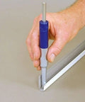 Hand using 8 Inch Blue Heavy Duty Trim Nail Punch for Soffit, Fascia, and Finishing Trim, Steel Nose, Aluminum Tail, Drives 1-1/4 Inch Nails