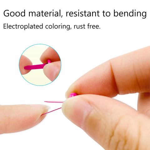 Close-up of a person bending a pink pin from the 100 Piece Brass Paper Fasteners Set Multicolor Mini Brads For Paper Crafts DIY Projects Pins For Crafts Lovers Sturdy No Rust Easy Bend Durable Metal Fasteners For Scrapbooks