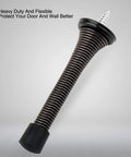 Two Pack Premium Spring Door Stoppers In Glossy Oil Rubbed Bronze Featuring Flexible Black Rubber Pads To Protect Drywall And Solid Doors Totally Effortless Setup For Quick Apartment Upgrades That Seriously Deliver - Close-up of a flexible spring door stopper with rubber base.