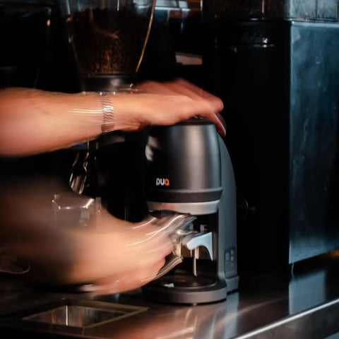 Electric Auto Leveling Espresso Tamper For 57.3 Mm Portafilters in action, tamping with consistent pressure, ideal for baristas.