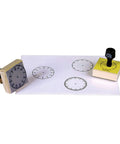 Totally Sweet Wooden Analog Clock Stamp Set for Kids Learning To Tell Time with detailed clock face stamps and paper.