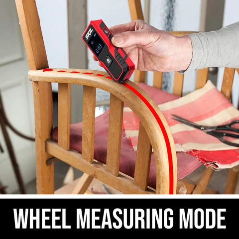 Person using 65 Feet Laser Distance Measurer With Wheel Measuring Mode For Uneven Surfaces on a chair armrest