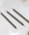 20pcs Premium Stainless Steel Extension Springs Kit With Hook Ends For Quick Fixes And Heavy Duty Repair Jobs To Fix Appliances, Gates, Hardware Projects And Home Maintenance Needs Effortlessly. Three black stainless steel extension springs with hook ends