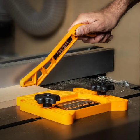 Hand using Two Piece Universal Featherboard And Magnetic Push Stick Safety Kit For Table Saws Router Tables And Jointers Keeps Your Shop Safe And Your Cuts On Point Every Cut
