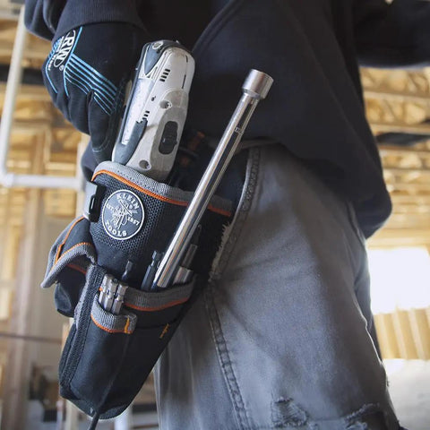 Tradesman Pro Drill Pouch With Pockets For Tools And Bits, Heavy Duty 1680D Ballistic Weave on a worker's belt in use