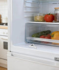 Close-up of 8 Pack Aluminum Shelf Clips for Fridge and Freezer on refrigerator shelf with fresh produce inside