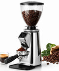 Kickass Sixty Four Millimeter Flat Burr Electric Coffee Grinder With Adjustable Portafilter Stand And Massive Seven Hundred Fifty Gram Hopper, silver color, with coffee beans in hopper.