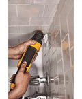 Person using Diamond Grit Oscillating Tool Blade With Swing Design For Tight Access Long Life Carbide Edge For Aggressive Material Removal.