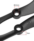 Close-up of black nylon Rugged RC Propellers 8x4.5 Inch Nylon Two Vane CW CCW Set with adapter rings showing 6.3mm shaft.