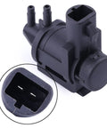 Black plastic 4x4 hub lock actuator vacuum solenoid with two ports and 13mm electrical connector (front view)