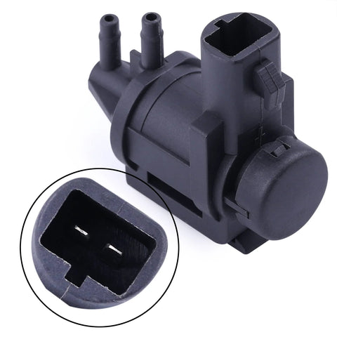 Black plastic 4x4 hub lock actuator vacuum solenoid with two ports and 13mm electrical connector (front view)