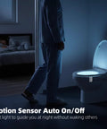 Person approaches toilet with Two Pack Toilet Night Lights With Motion Activated Sensor And 16 Color Changing LED Inside Toilet Bowl Nightlight For Bathroom Decor Auto On With Movement Stays On Two Minutes After Last Detection Fun Gift For Men And Kids