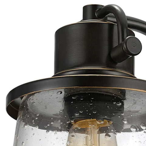Close-up of Oil Rubbed Bronze Outdoor Indoor Wall Sconce With Seeded Glass Shade No Fuss Easy Install 1 Light LED Bulb Included