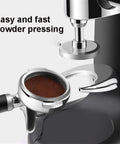 Top Shelf 58 Mm Coffee Tamper With Ergonomic Grip And Solid Steel Base For Zero Sweat Espresso Compaction And Barista Grade Pulls Straight From Your Kitchen Counter, view showing coffee grounds being compacted.