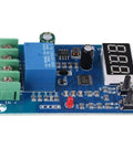 No Sweat Battery Charge Control Module With Crisp Digital Screen For Easy Six To Sixty Volt Charging And Discharging Ten Amp Setup Sweet For Solar Wind Cars And Ev Rides, blue circuit board with digital display.