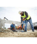 Worker using SpeedXtreme SDS Max Rotary Hammer Drill Bit 1 In Diameter With 100 Percent Carbide Head And Four Cutter Design