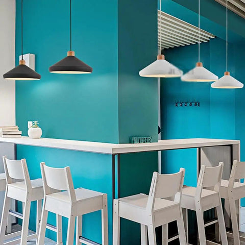 Nordic Industrial Pendant Light E26 Adjustable Height Wood Metal Chandelier for Kitchen Island Dining Room(White,35cm) over a sleek bar.