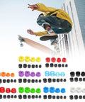 Colorful PU bushings and components from the Skateboard Truck Rebuild Kit with a skateboarder performing a trick in the background.