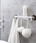 Slick Self Adhesive Bathroom Towel Rack And Wall Mount Hook Organizer For Kitchen Living Room Heavy Duty Steel Look Single Grip Holder Smooth Finish Vibe Style with towels and loofahs.