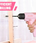 Pink Cordless Drill Kit With Three-Eighths Inch Keyless Chuck in use drilling a wooden plank