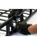 Axe And Shovel Mount For 5 Inch Height Racks Built Tough being clamped onto black rack side rail, black epoxy coated.