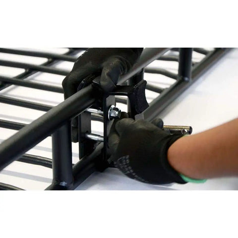 Axe And Shovel Mount For 5 Inch Height Racks Built Tough being clamped onto black rack side rail, black epoxy coated.