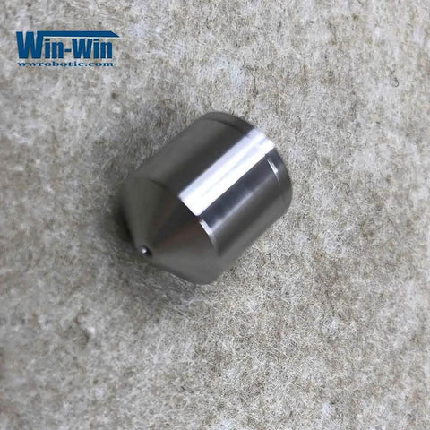 Close-up of Allfi waterjet valve seat poppet for head assembly; metallic cylindrical body with conical end.
