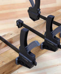 Four Six Piece Easy To Use One Handed Trigger Clamp Set With Four Inch And Six Inch Clamps In Black And Grey Includes Two Four Inch Clamps And Four Six Inch Clamps Built Tough In Durable Nylon With Hardened Steel Bars And Non Marring Grippy Pads installed on wooden boards