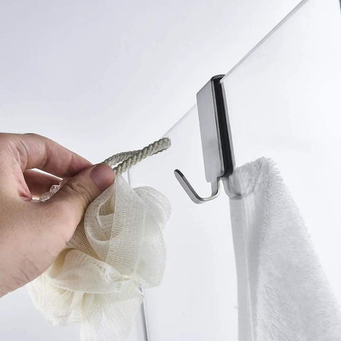 Hand using Double Hooks For Glass Shower Door Over The Bathroom Glass Wall 0.31-0.39 Inch Brushed Stainless Steel 304 2 Pack
