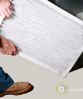 Person installing Easy Fit Pleated Air Filter 18x24x1 17.75x23.75 MERV 8 pack of four for home AC and furnace