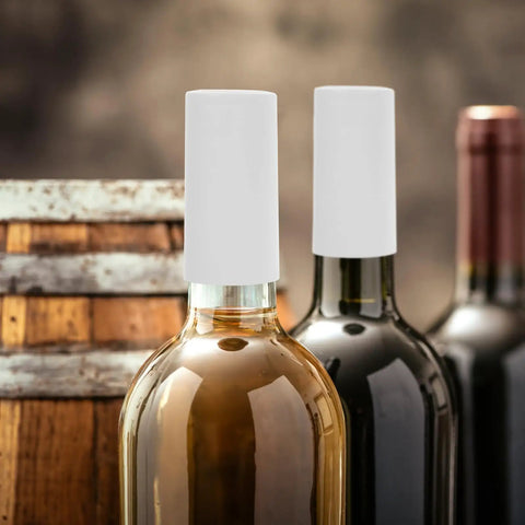Snag These White PVC Heat Shrink Wine Bottle Caps A Dope One Hundred Pack To Keep Open Bottles Fresh With An Airtight Seal That Kills Oxidation Cold Zero Fuss Just Heat For A Snug Fit Around Any Neck Sweet For Weekend Sipping Or Quick Stashing. Two wine bottles with white PVC heat shrink caps on necks.