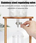 Top Shelf Cold Brew Coffee Maker With Clear Glass Carafe And Sturdy Wood Base Stainless Steel Drip Valve close-up of adjustable valve.