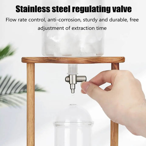Top Shelf Cold Brew Coffee Maker With Clear Glass Carafe And Sturdy Wood Base Stainless Steel Drip Valve close-up of adjustable valve.