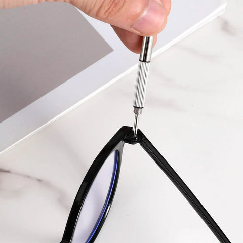 Person using screwdriver to attach arm with DIY Glasses Temple Replacement Arms Kit With Screws, Washers, Screwdriver And Nose Pads TR90 Eyeglasses Repair Set In Black Easy Install All-In-One Eyewear Fix Kit Great For DIYers And Pros, Includes Durable TR90 Arms For Comfy Wear