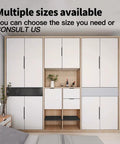 White modern wardrobe with multiple cabinet sizes available in a bedroom setting