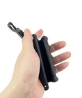 Hand holding 2 Pack Archery Arrow Puller Gripper With Belt Clip For No Fuss Target Removal Grab It Quick Soft Rubber Extractor Tool
