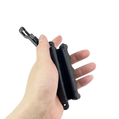 Hand holding 2 Pack Archery Arrow Puller Gripper With Belt Clip For No Fuss Target Removal Grab It Quick Soft Rubber Extractor Tool