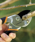 Power-Lever Anvil Pruner, 5/8-Inch Cut Capacity, Heavy-Duty Branch Cutter trimming a small dry branch in garden