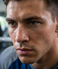Close-up of a man with an Implant Grade Titanium Nose Stud 20G With Dope Cubic Zirconia Sparkle, perfect for sensitive skin.
