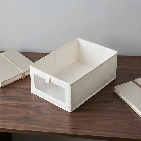 Heavy Duty Cotton Linen Foldable Storage Bins Stackable Closet Organizers on a wooden table with books.