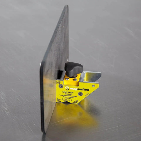 Dope Mini Angle Welding Magnet With Multi Angle Holder, 80 Lb Holding Power, shown holding metal at 90 degrees on a table